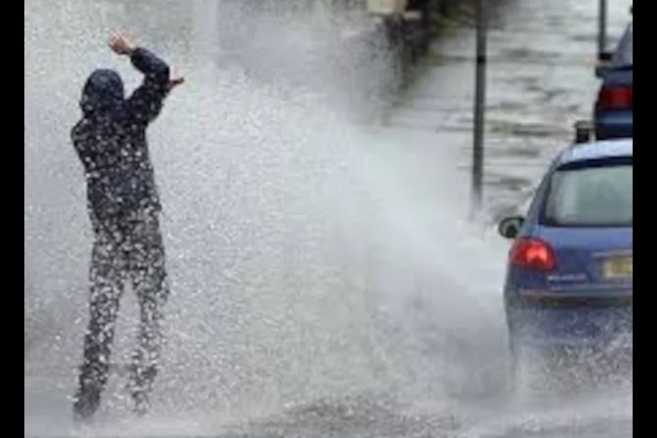 A rainy street scene where a car splashes water onto a pedestrian, paired with the text “When Life Gives You Water… Answer With Highlands Lather!” — a Rainy Day Soap Meme highlighting humor and handmade soap.